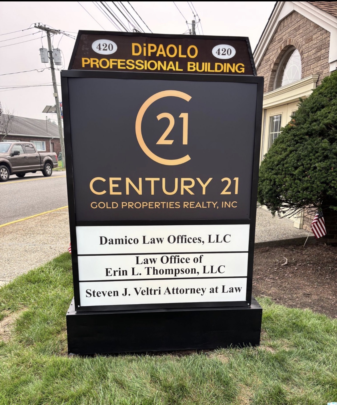 Century 21 Gold Properties Realty monument sign at DiPaolo Professional Building